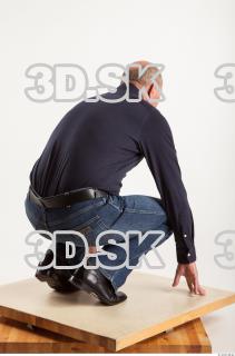 Kneeling pose blue deep shirt jeans of Ed 0006